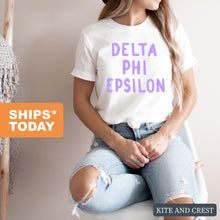 Load image into Gallery viewer, Delta Phi Epsilon T-shirt - DPHIE Purple Bubble Letters Tee - Kite and Crest