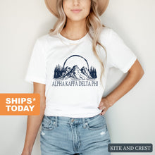 Load image into Gallery viewer, Alpha Kappa Delta Phi Epic Mountains T-shirt - Kite and Crest
