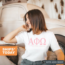 Load image into Gallery viewer, Alpha Phi Omega Classic Pink Letters Comfort Colors T-Shirt - Kite and Crest
